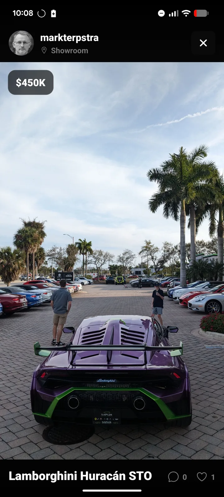 Showvroom post of a purple Lamborghini Huracán STO at a showroom